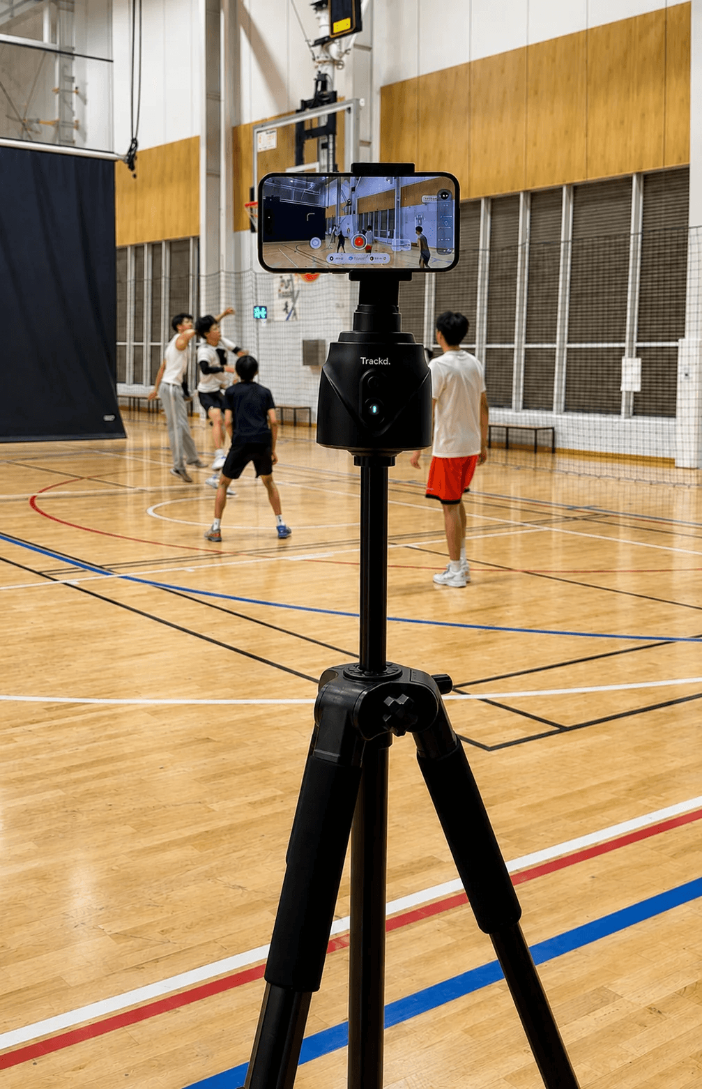 Trackd filming a group basketball session with an iPhone on a tripod